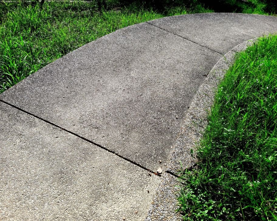 When to Resurface Concrete Walkway vs Replace
