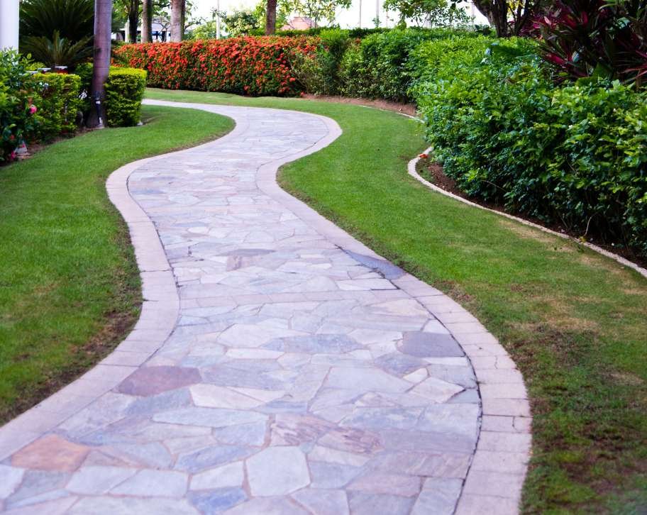 Protect your stone and concrete walkway with proper drainage. Expert tips for Fredericton's climate, from French drains to permeable pavers. Prevent costly water damage.