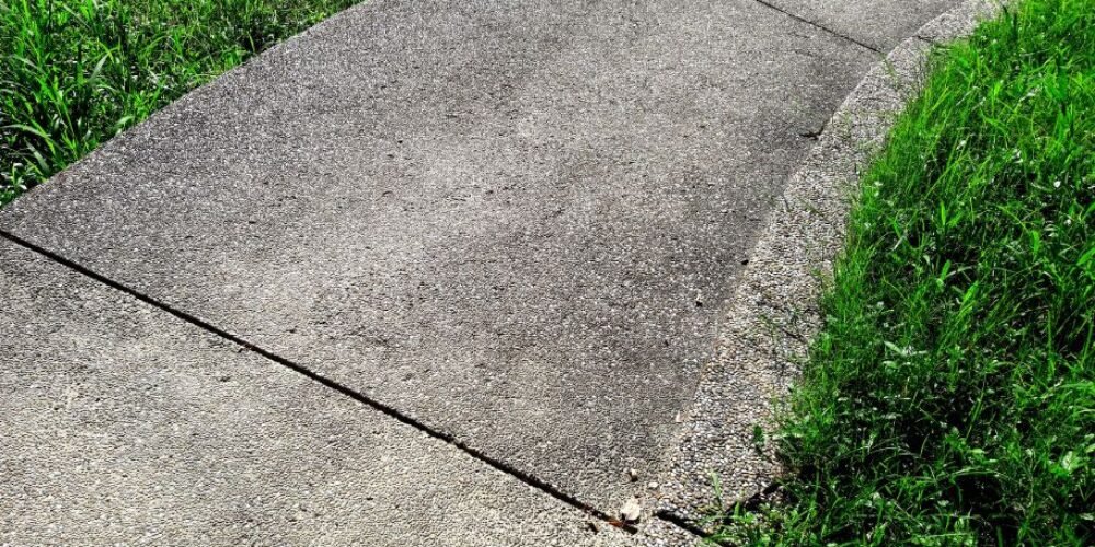 When to Resurface Concrete Walkway vs Replace?