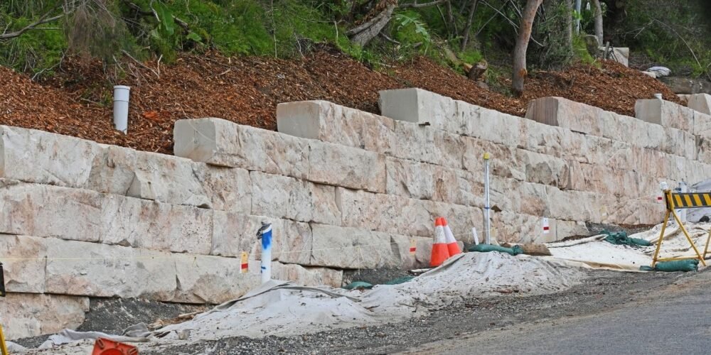 How to address settling issues with retaining walls?
